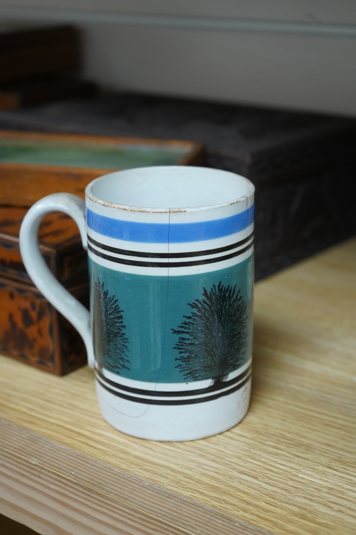 Two early 19th century Mocha ware jugs and two mugs, largest 16cm high